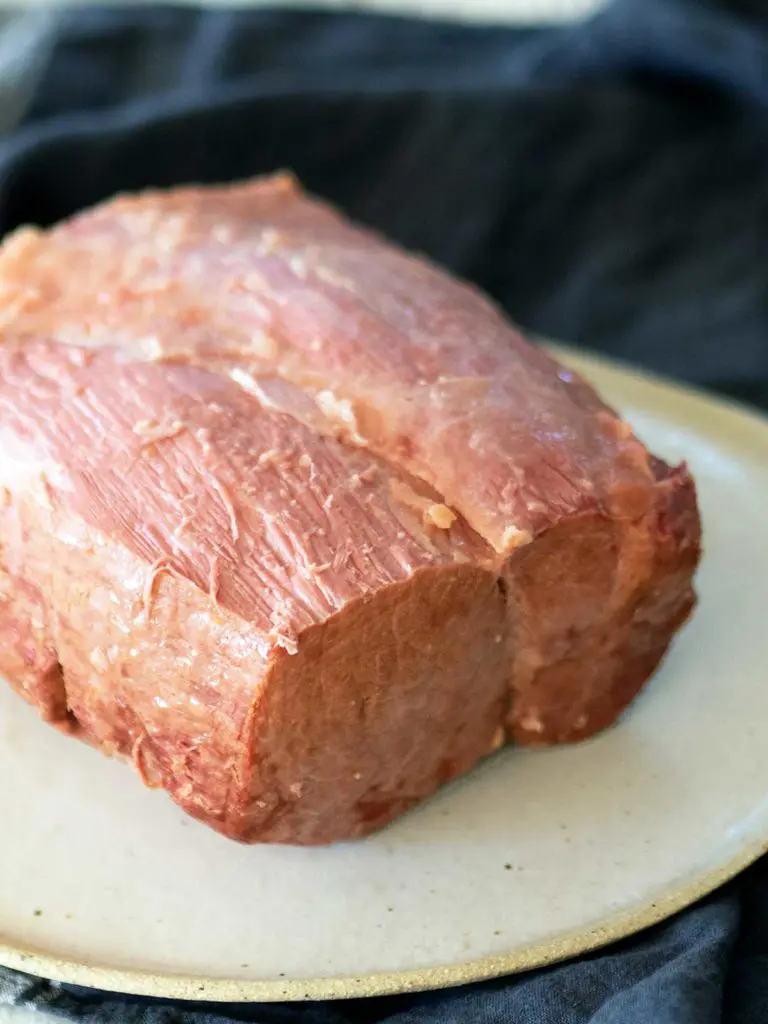 cooked corned beef with fat removed on a plate