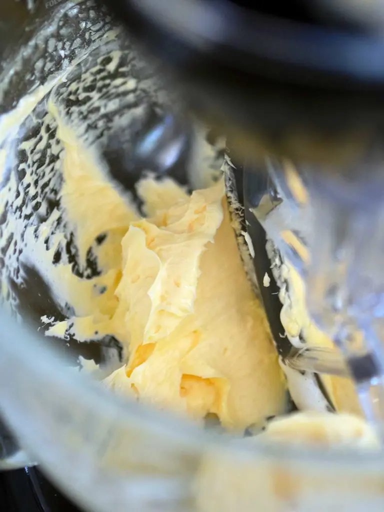 butter being creamed in a stand mixer