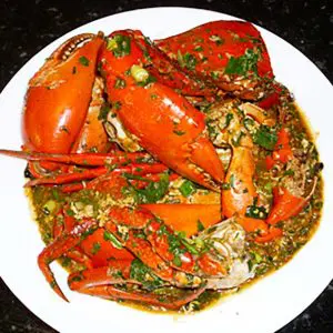 finished dish of chilli mud crab in a white bowl