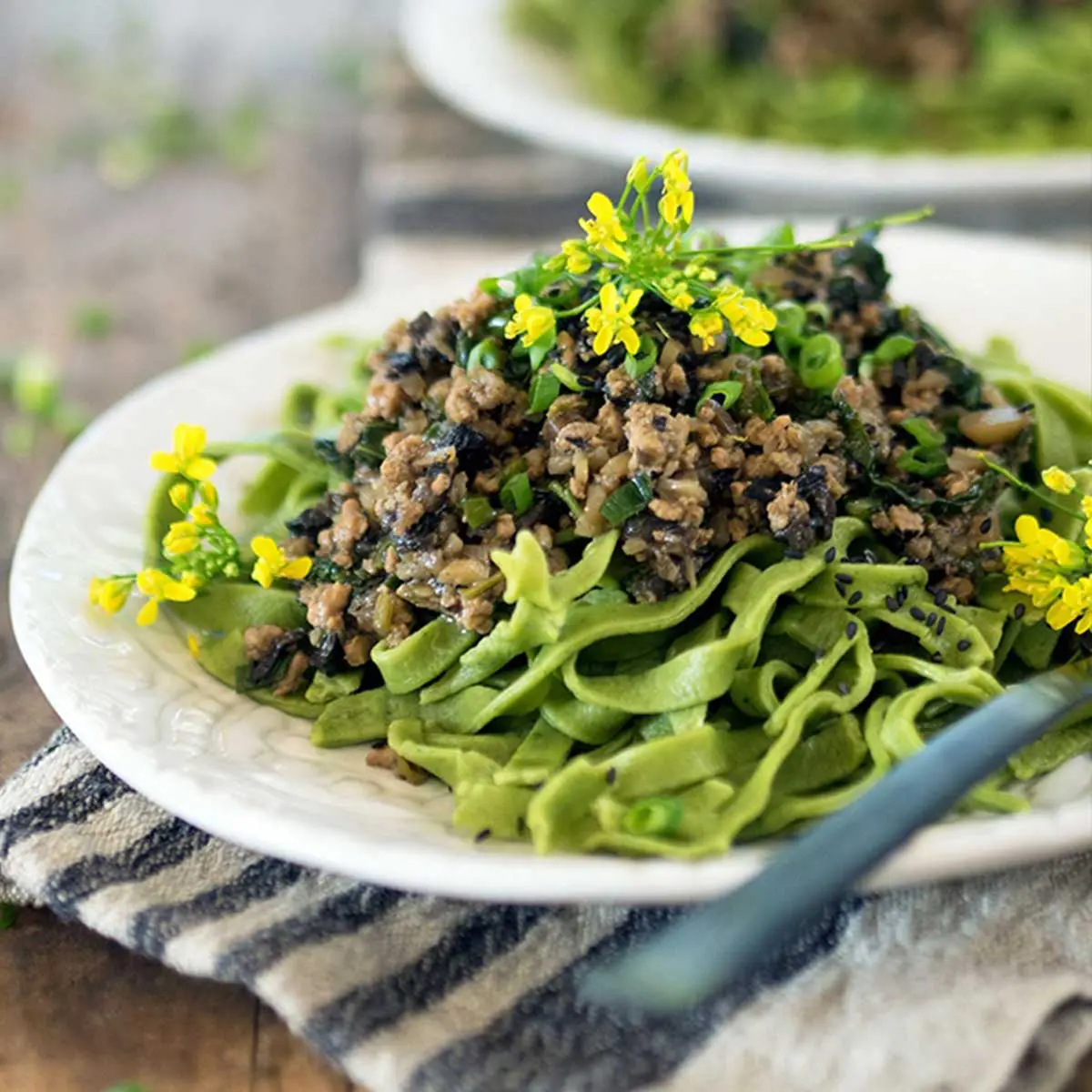 Minced pork and chestnut atop of green Tagliatelle