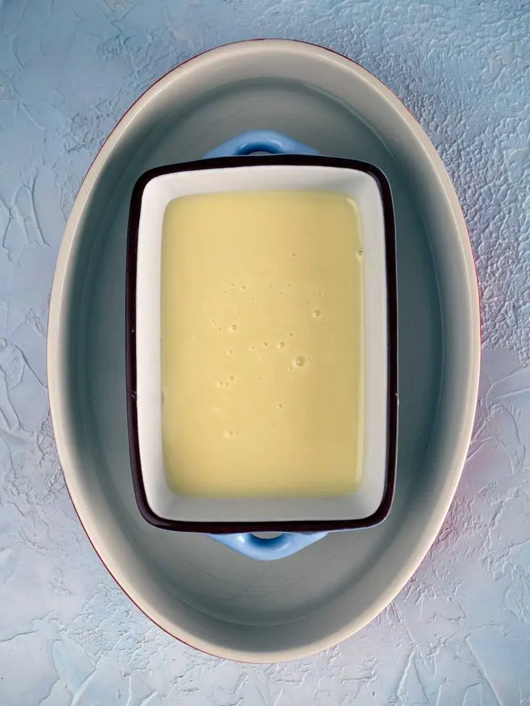 sweetened condensed milk in an oven proof dish ready for baking