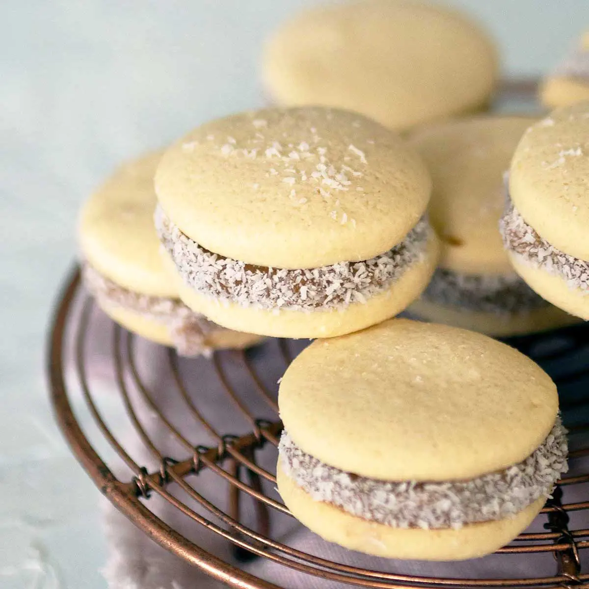 close up on alfajores de maicena cookies on a rack