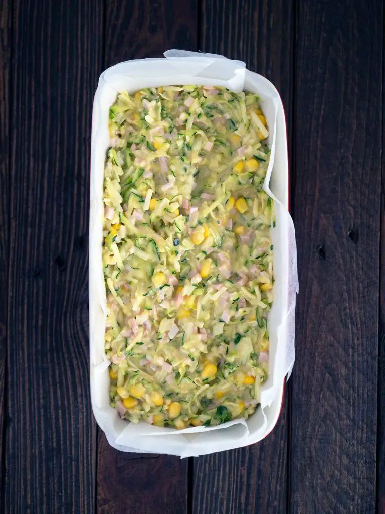 slice mixture in a lined baking tin ready for the oven