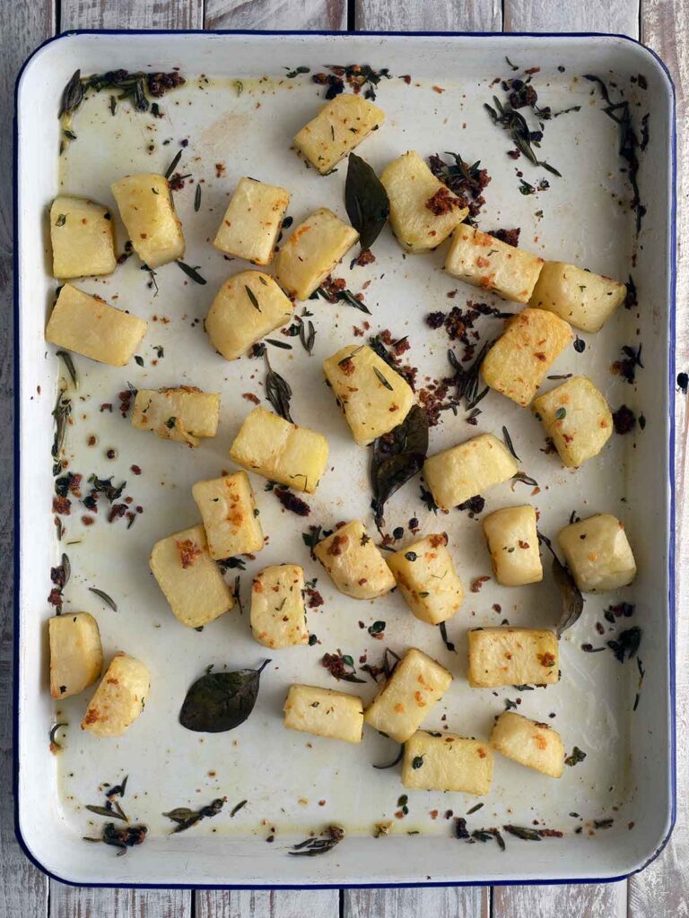 potatoes in a baking tray roasted