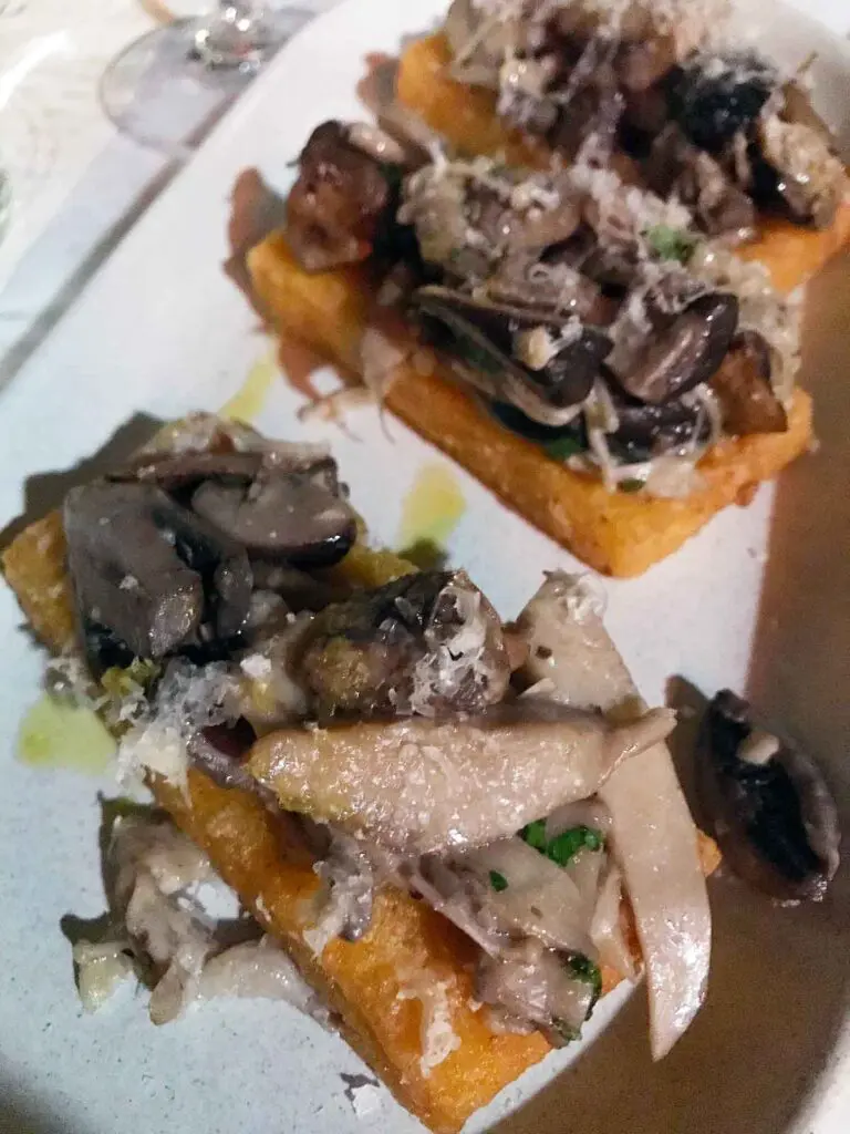 polenta fried and topped with mixed mushrooms