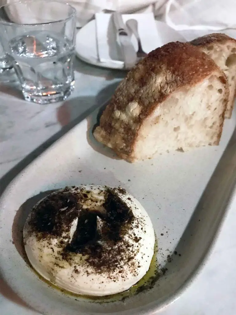 sour dough wedge and whipped ricotta on a plate