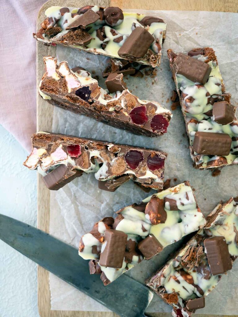 tam tam rocky road cut up into logs on a chopping board