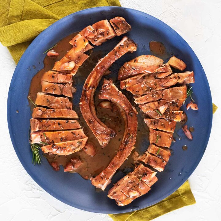 Tomahawk Pork Chops with Orange, Garlic, & Rosemary Belly Rumbles