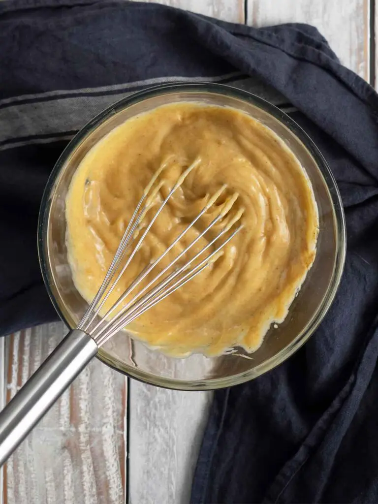whisking dressing in a bowl