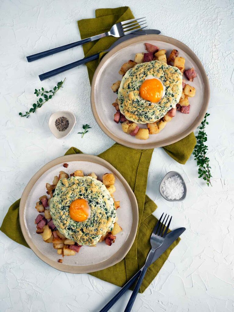 flat lay image of two plates of ham hash wth eggs sitting on top