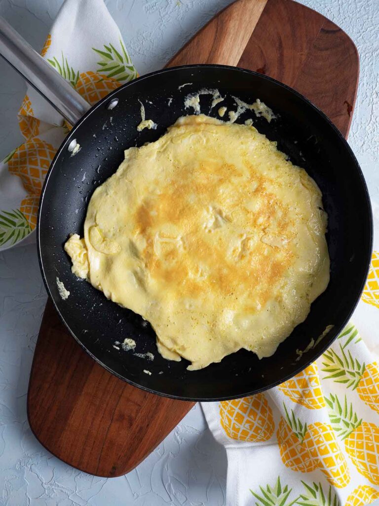 omelette flipped over in fry pan
