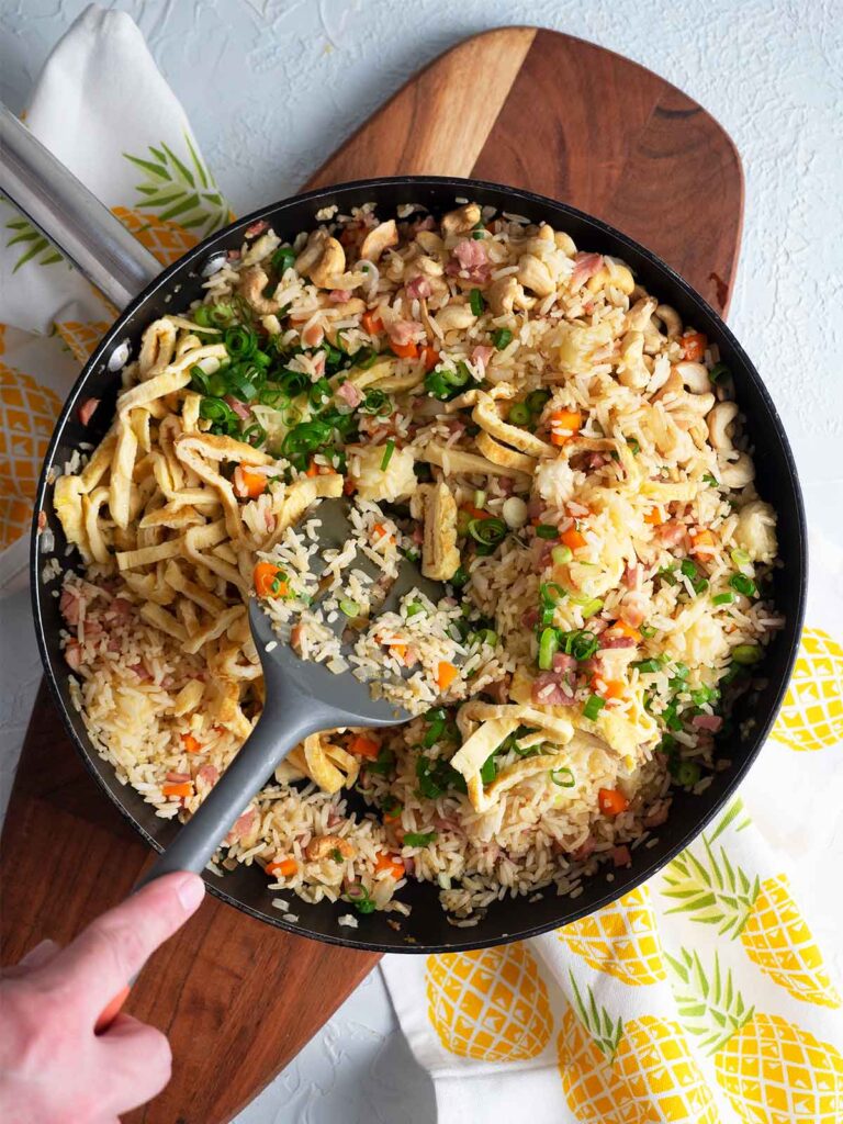 adding egg and scallions to the rice