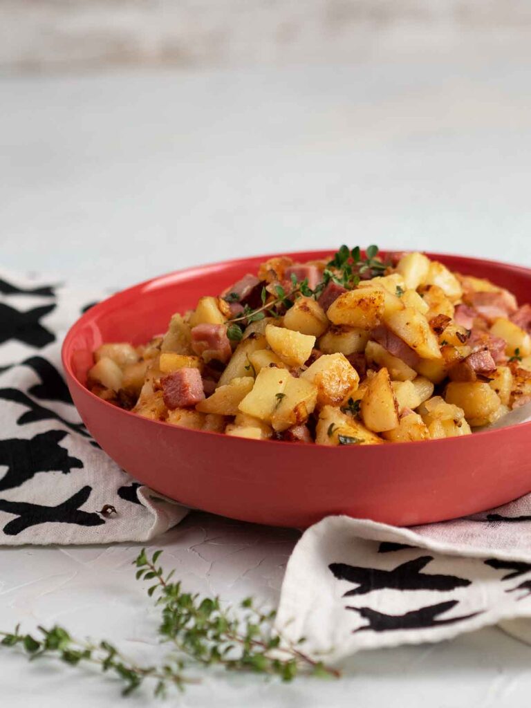 ham hash in a red serving bowl