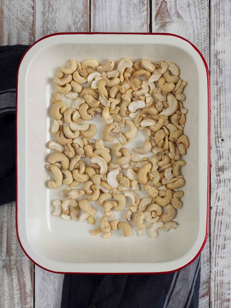 roasting cashews in a baking dish