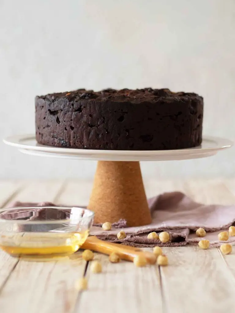 undecorated fruit cake on a cake stand