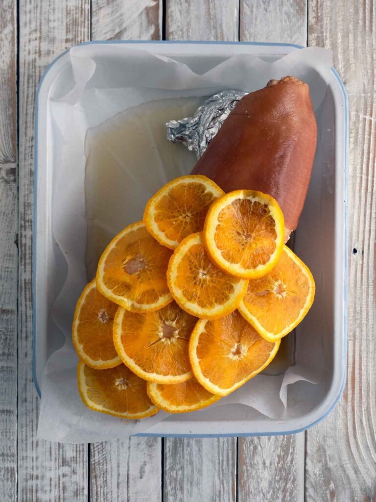 orange slices covering the ham