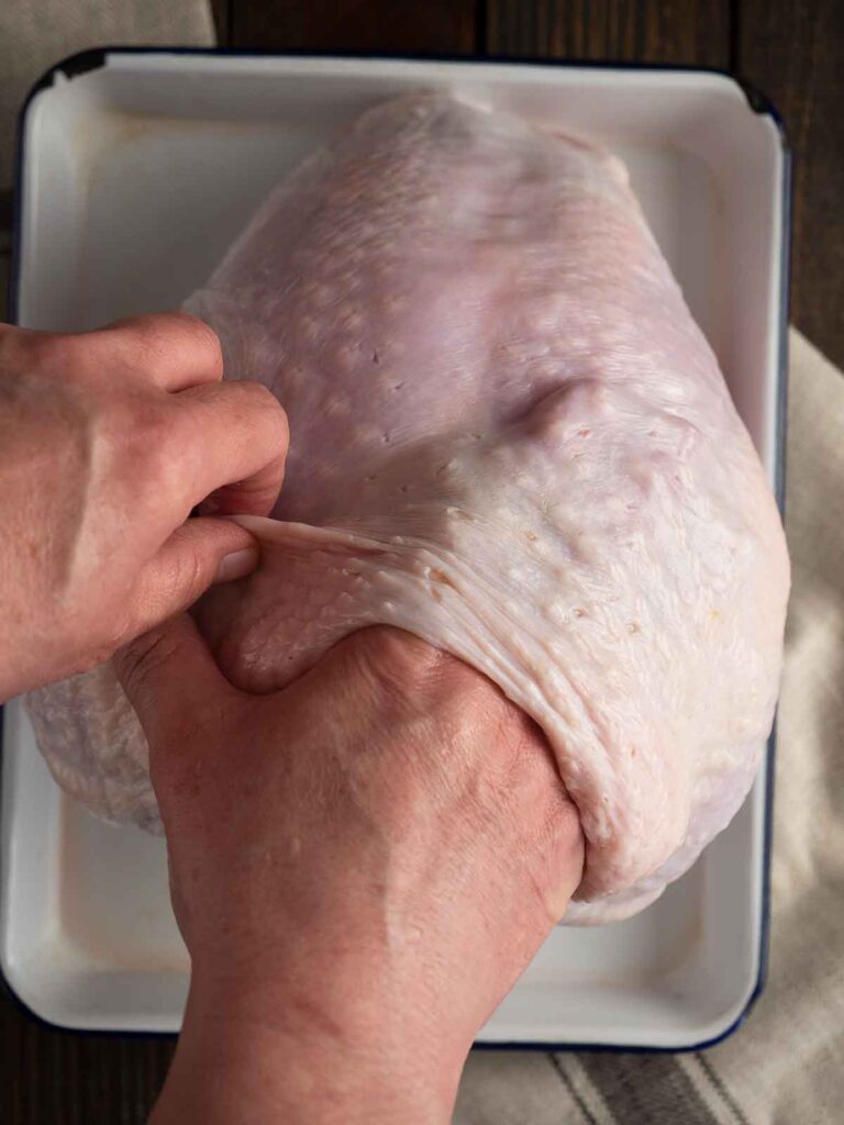 loosening the skin by running your hand gently between the skin and flesh of the breast