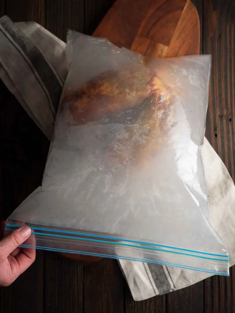 zip lock bag being sealed with the turkey and smoke inside