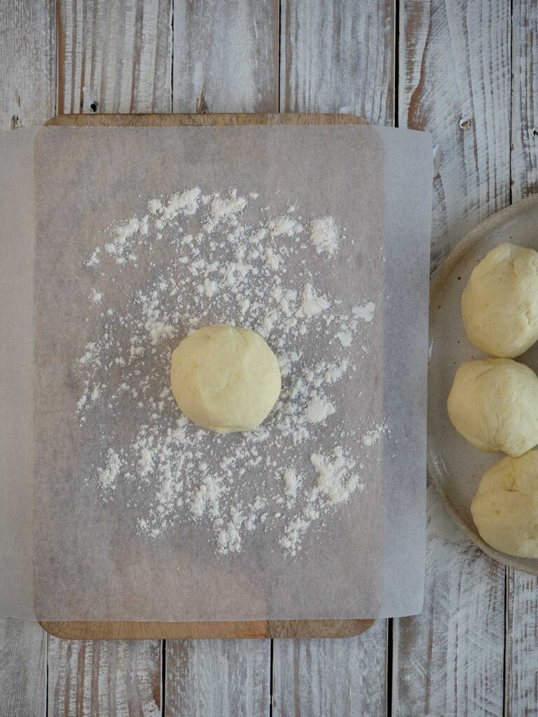 ball of dough on a floured surface