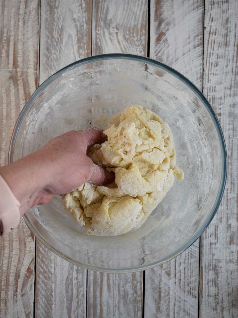 forming dough in a glass bowl