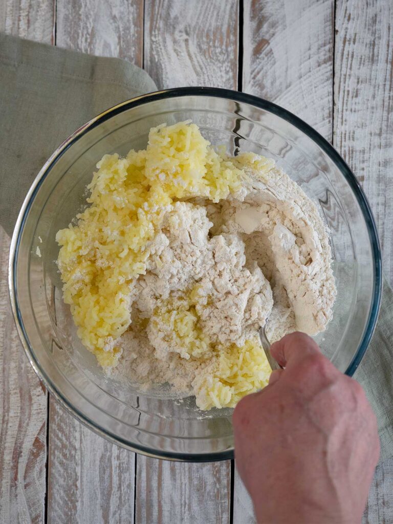 ingredients being mixed in a glass bowl