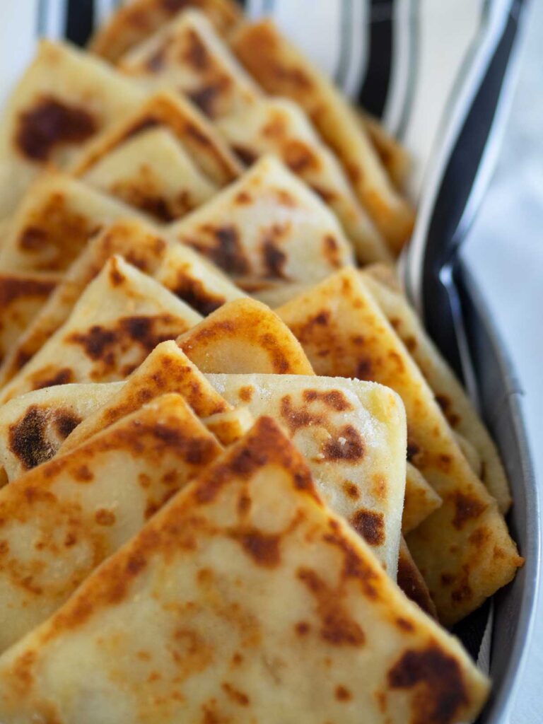 close up of triangles of Irish potato bread in a basket