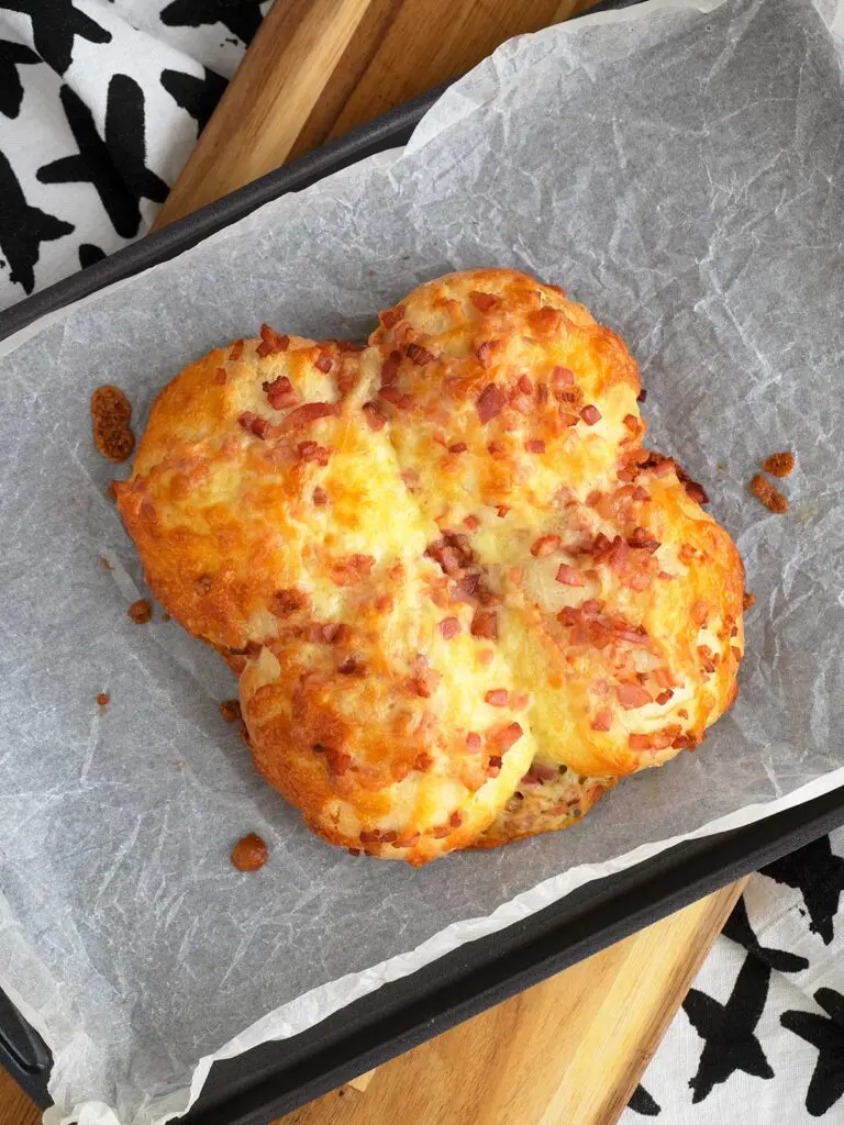 4 ingredient cheese and bacon rolls just out of the oven on a baking tray