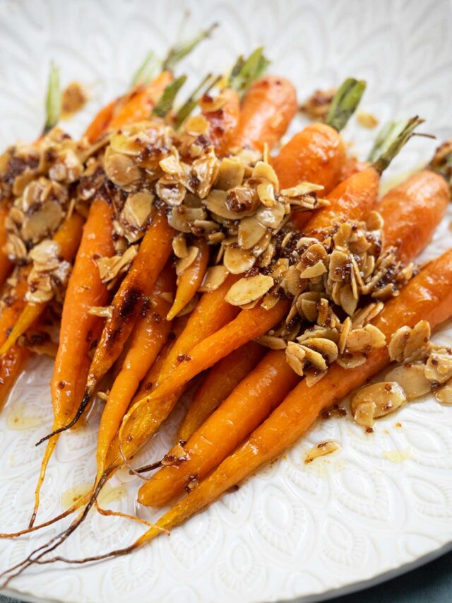 Roasted Dutch Carrots with buttery honey almonds Belly Rumbles