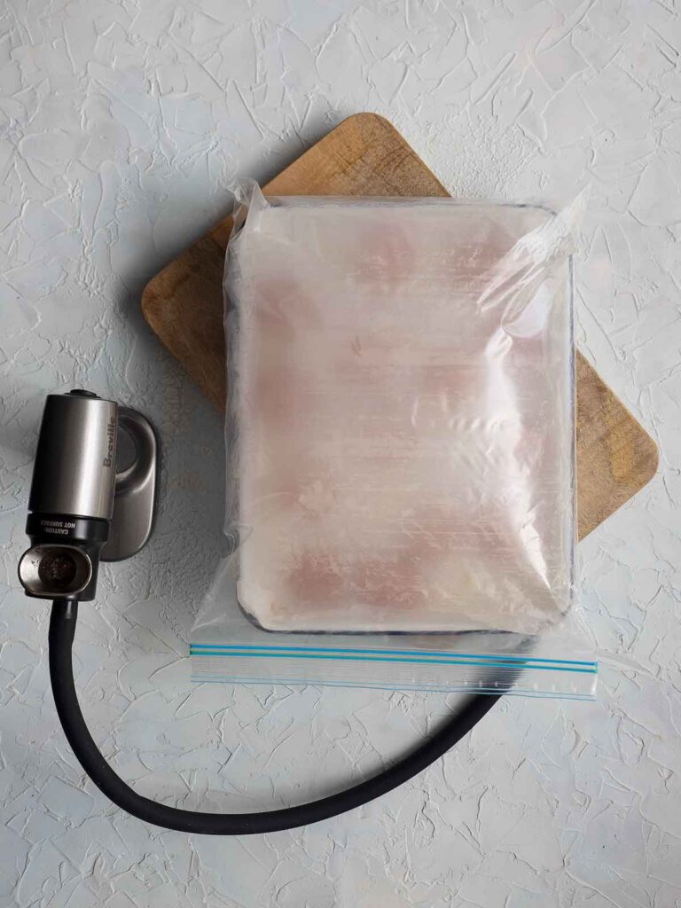 zip lock bag sealed with smoke and tomatoes inside