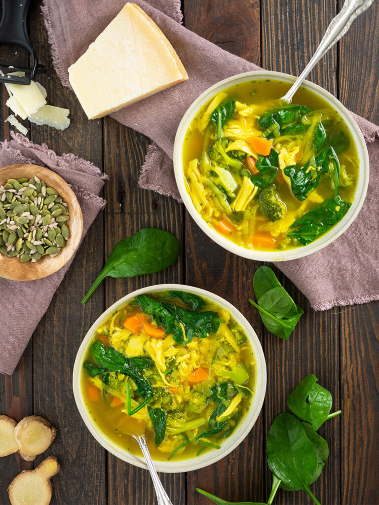 above view of ginger chicken soup in bowls