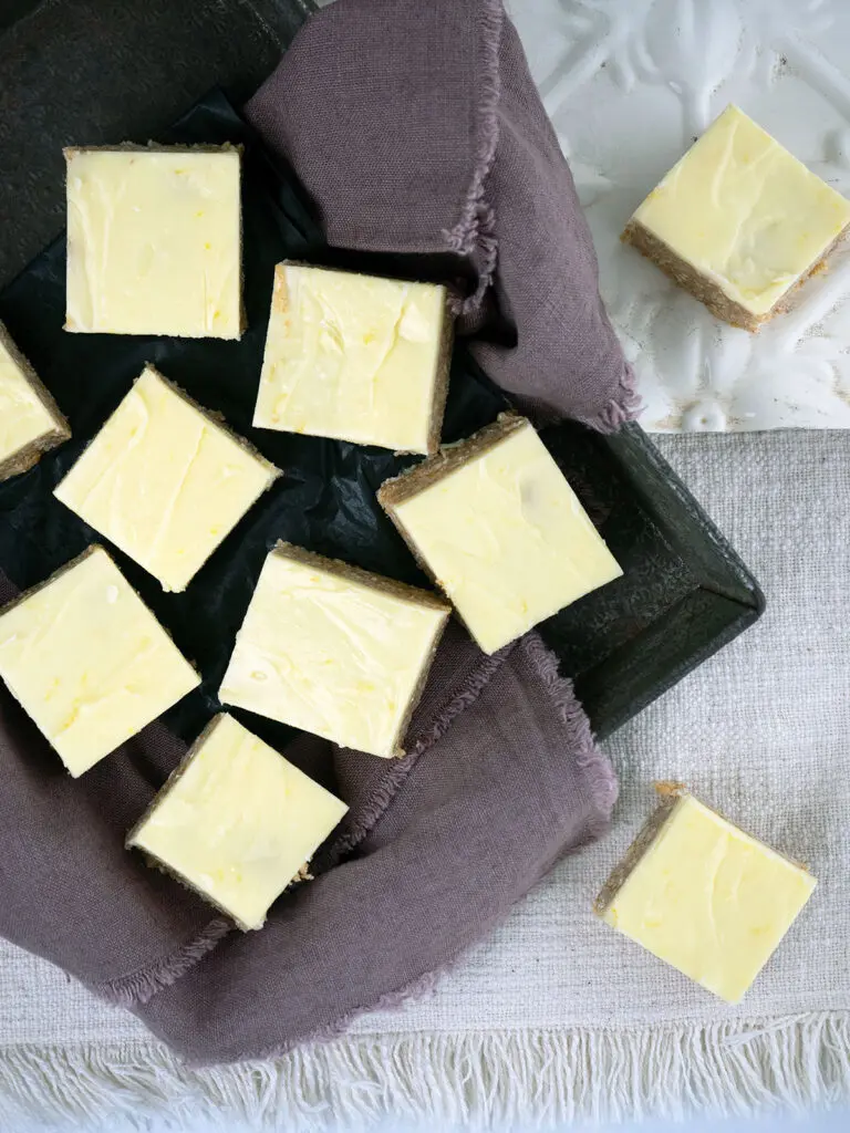 lemon slice cut into squares on a tray with purple cloth