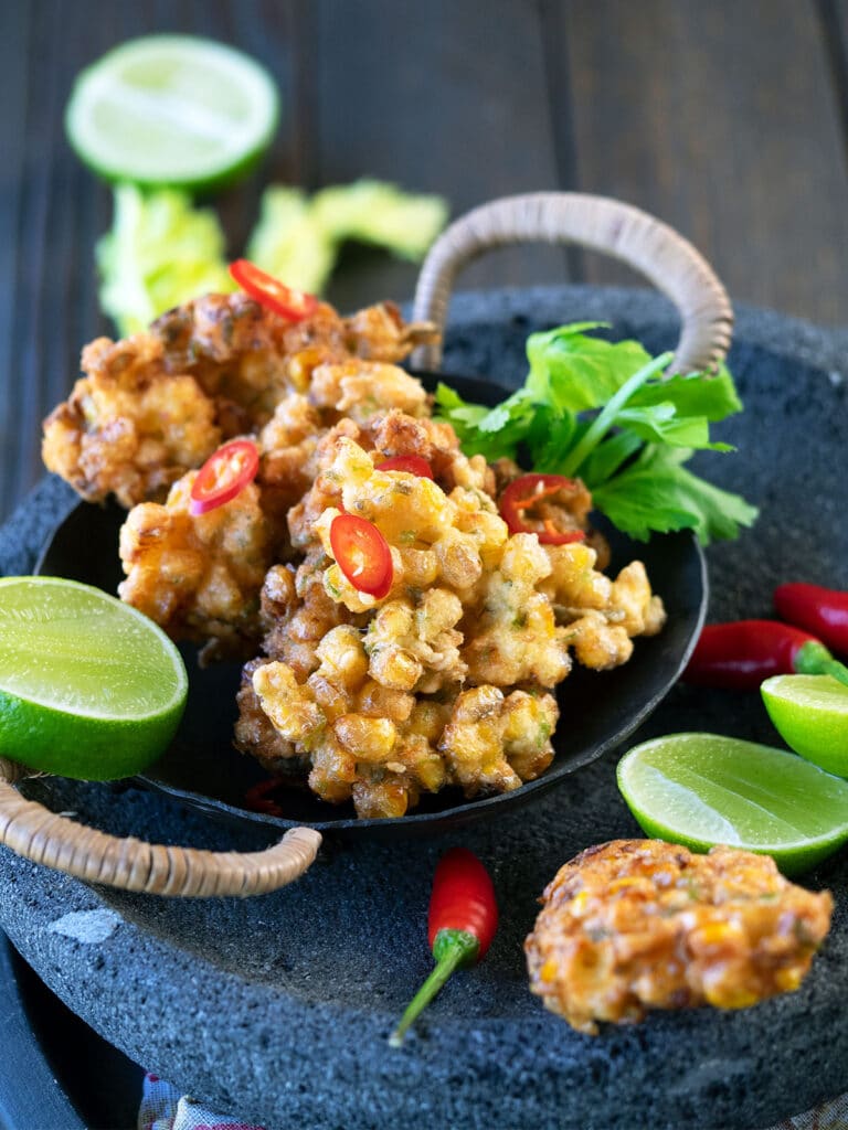 perkedel jagung served with lime and chili
