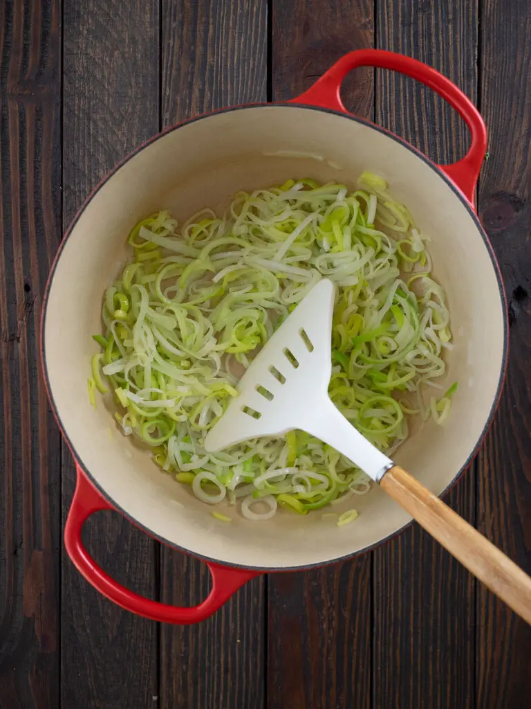 sautéing sliced leek in a dutch oven