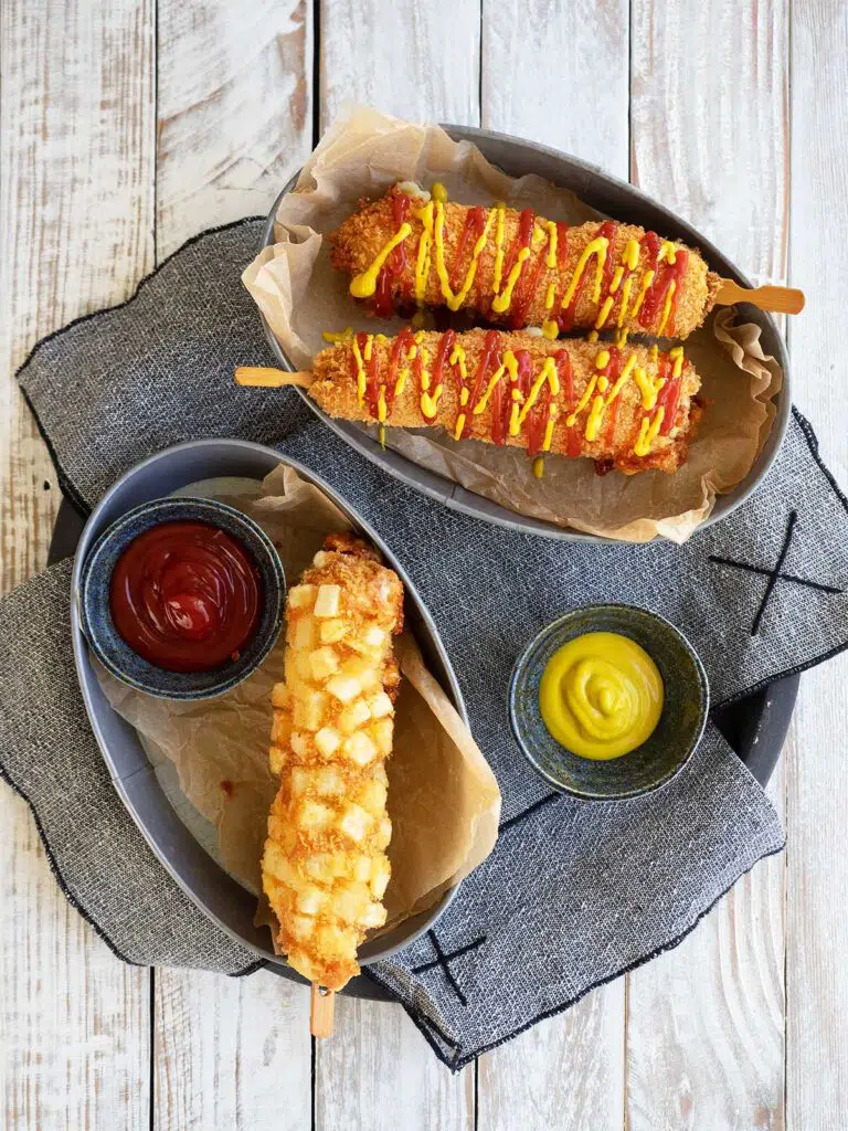 korean corn dogs on plates to serve