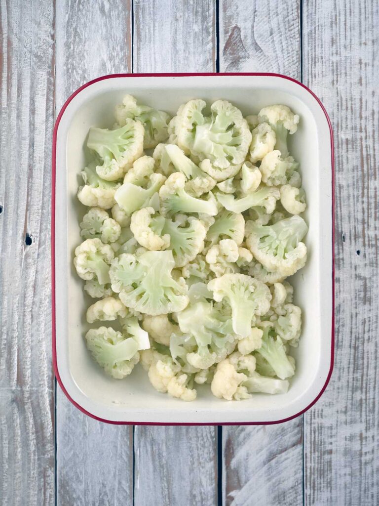 cauliflower laid out in a baking dish