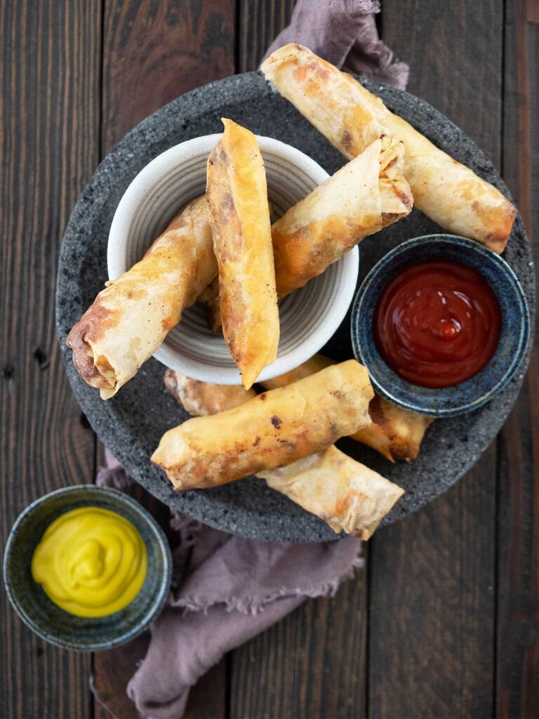 cheeseburger spring rolls served for eating