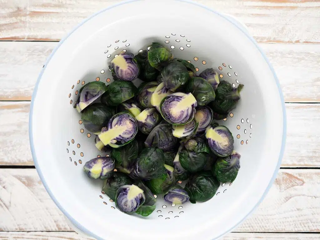 draining brussels sprouts in a colander