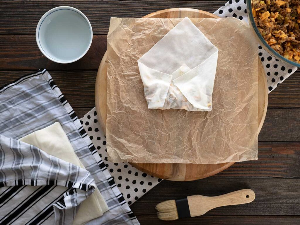 rolling the cheeseburger spring roll