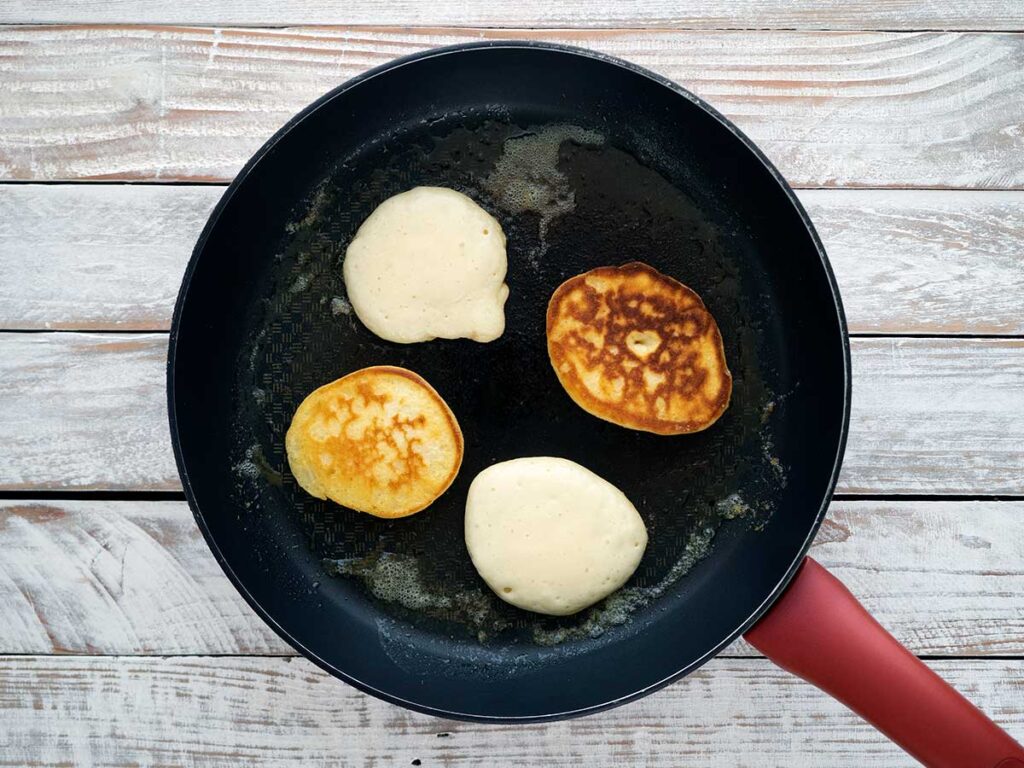 cooking pikelets in frying pan