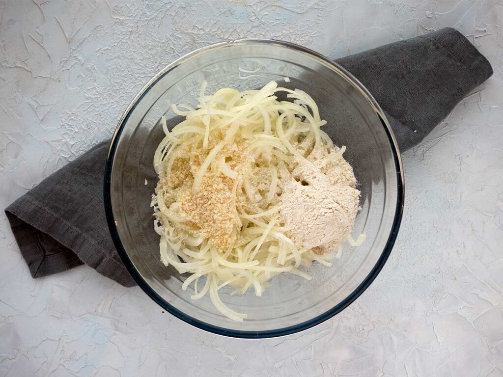 onion and breadcrumbs in a glass bowl