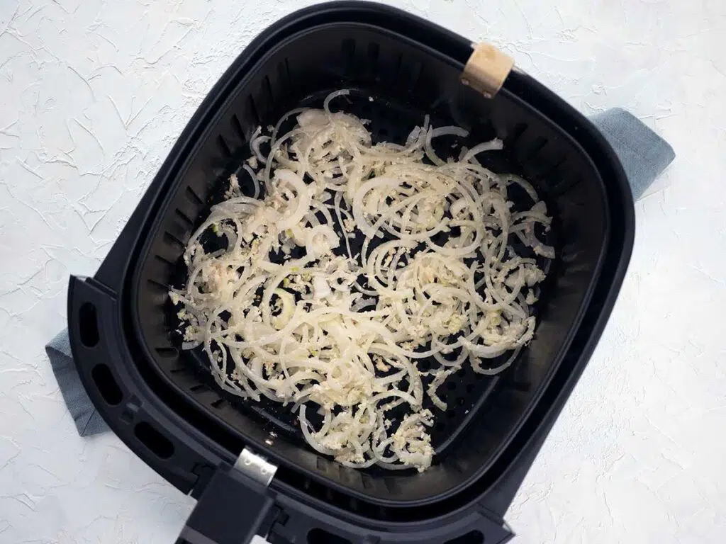 coated onions in the air fryer basket