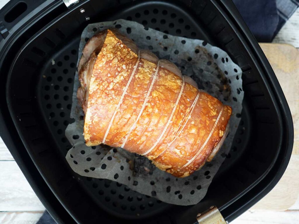 pork loin in air fryer basket after 20 minutes