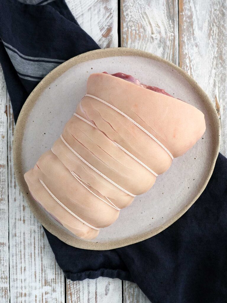 top view of raw rolled tied pork loin