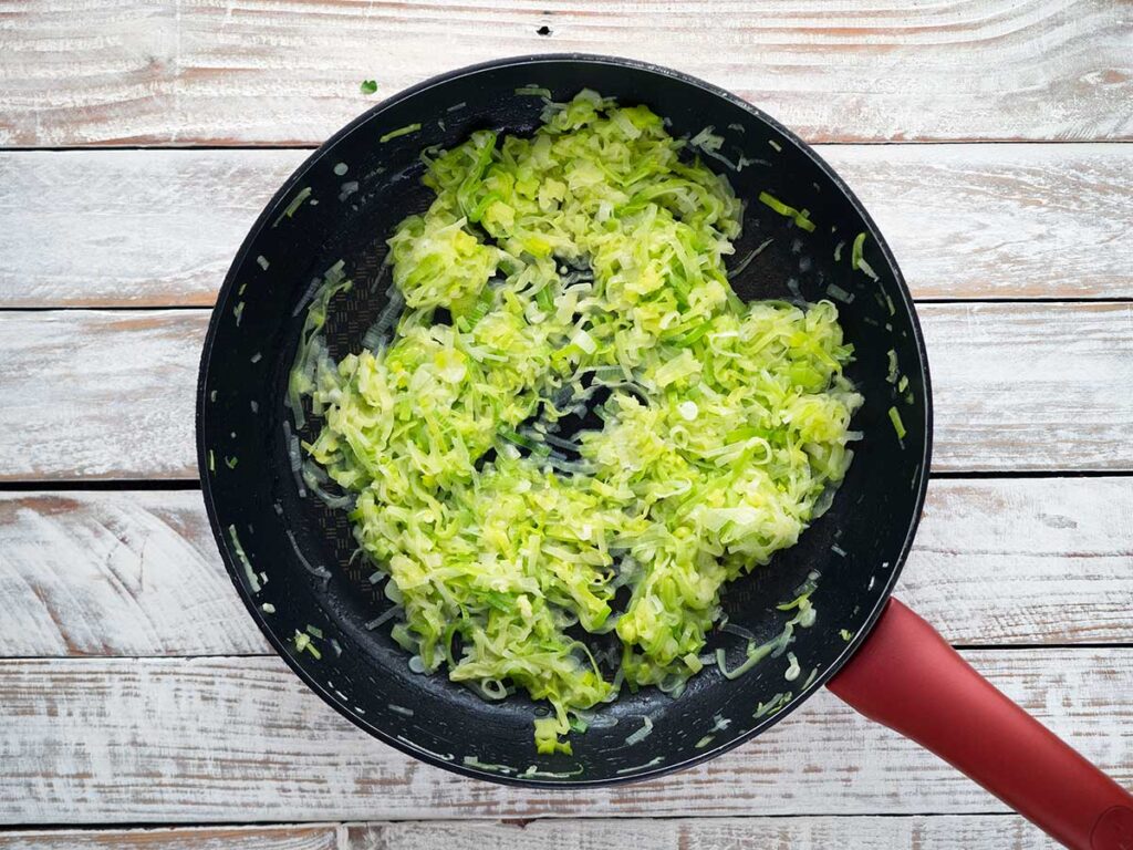 leeks cooking in a pan