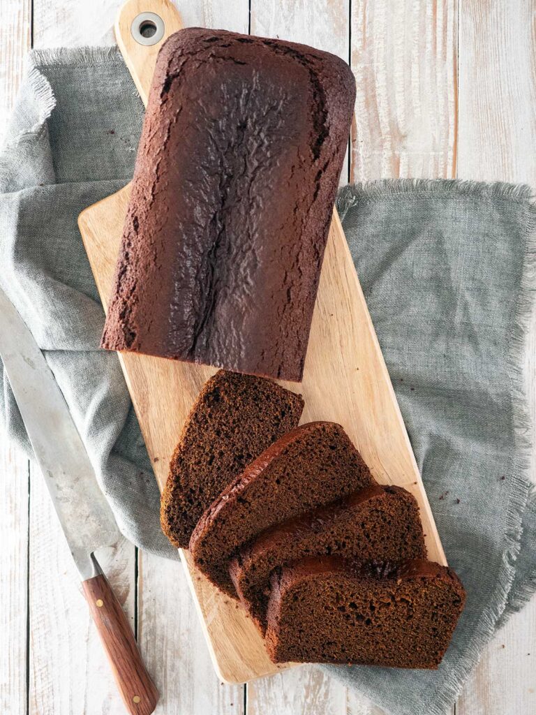 gingerbread cake on a board with slices of cake