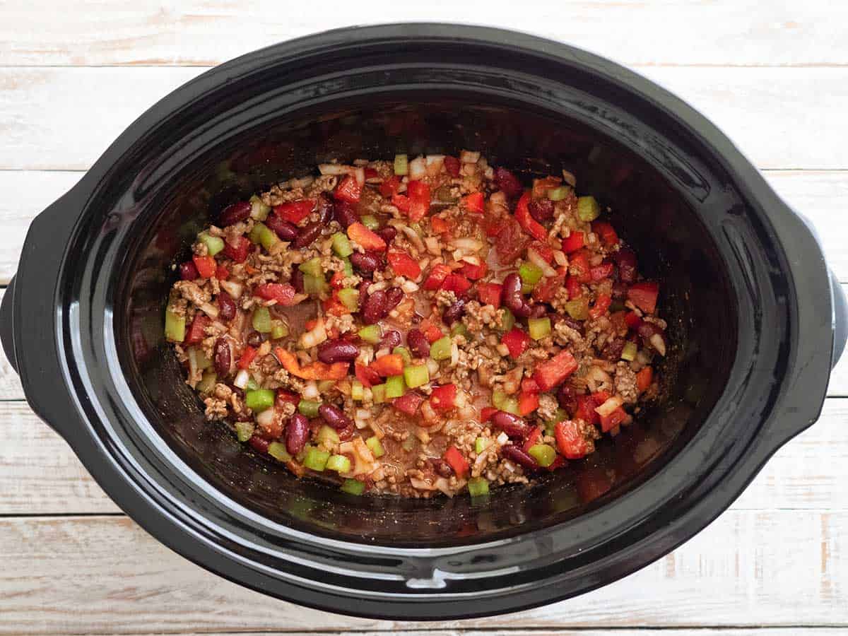 Chilli con carne ingredients mixed up in the slow cooker bowl ready for cooking.