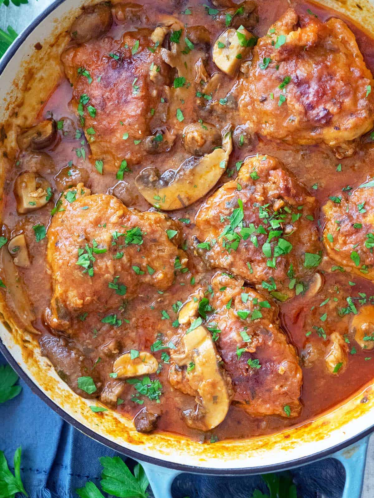 Cooked chicken chasseur, hunter's chicken, in the pan.