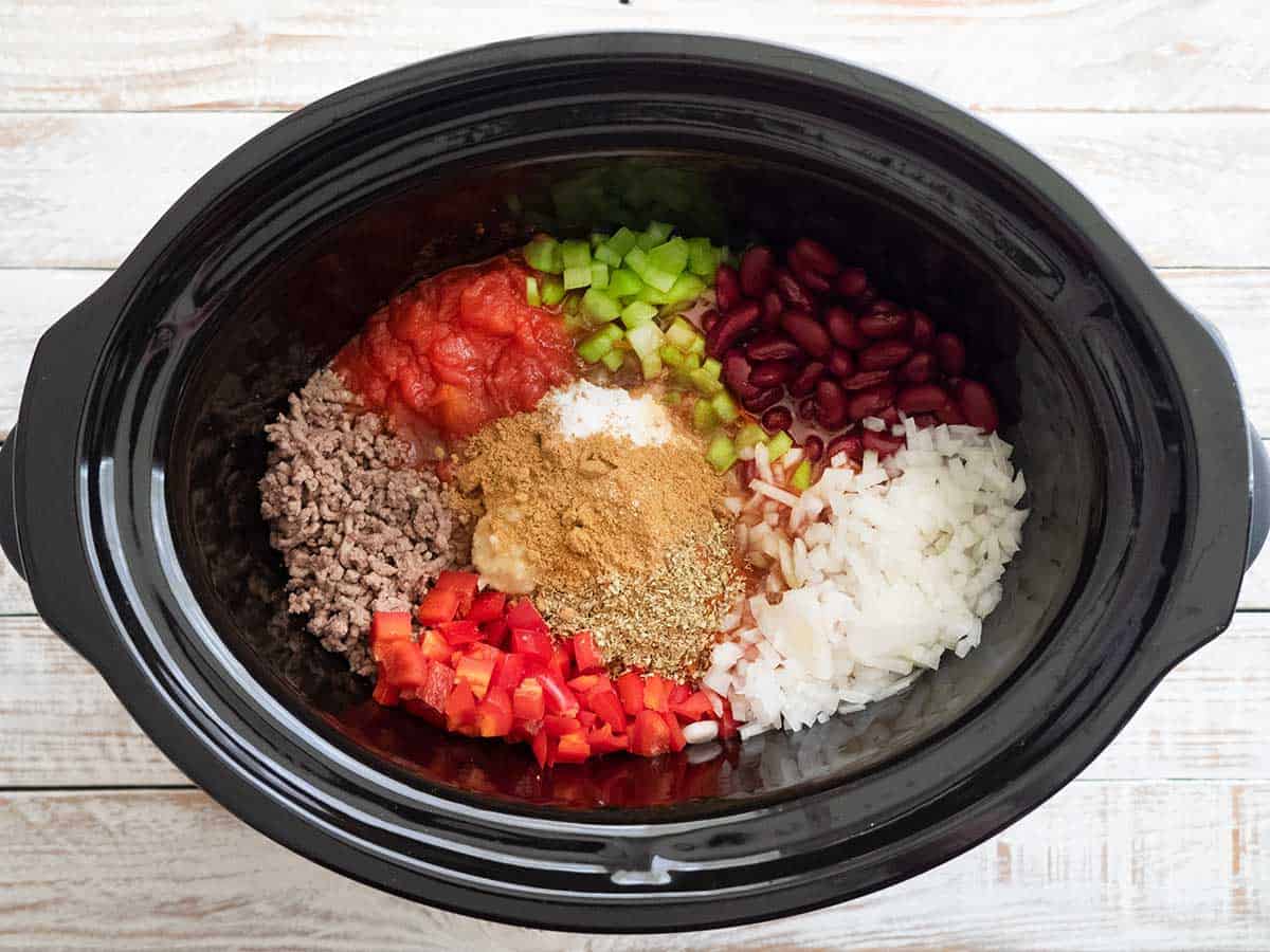 All the ingredients in the slow cooker bowl.