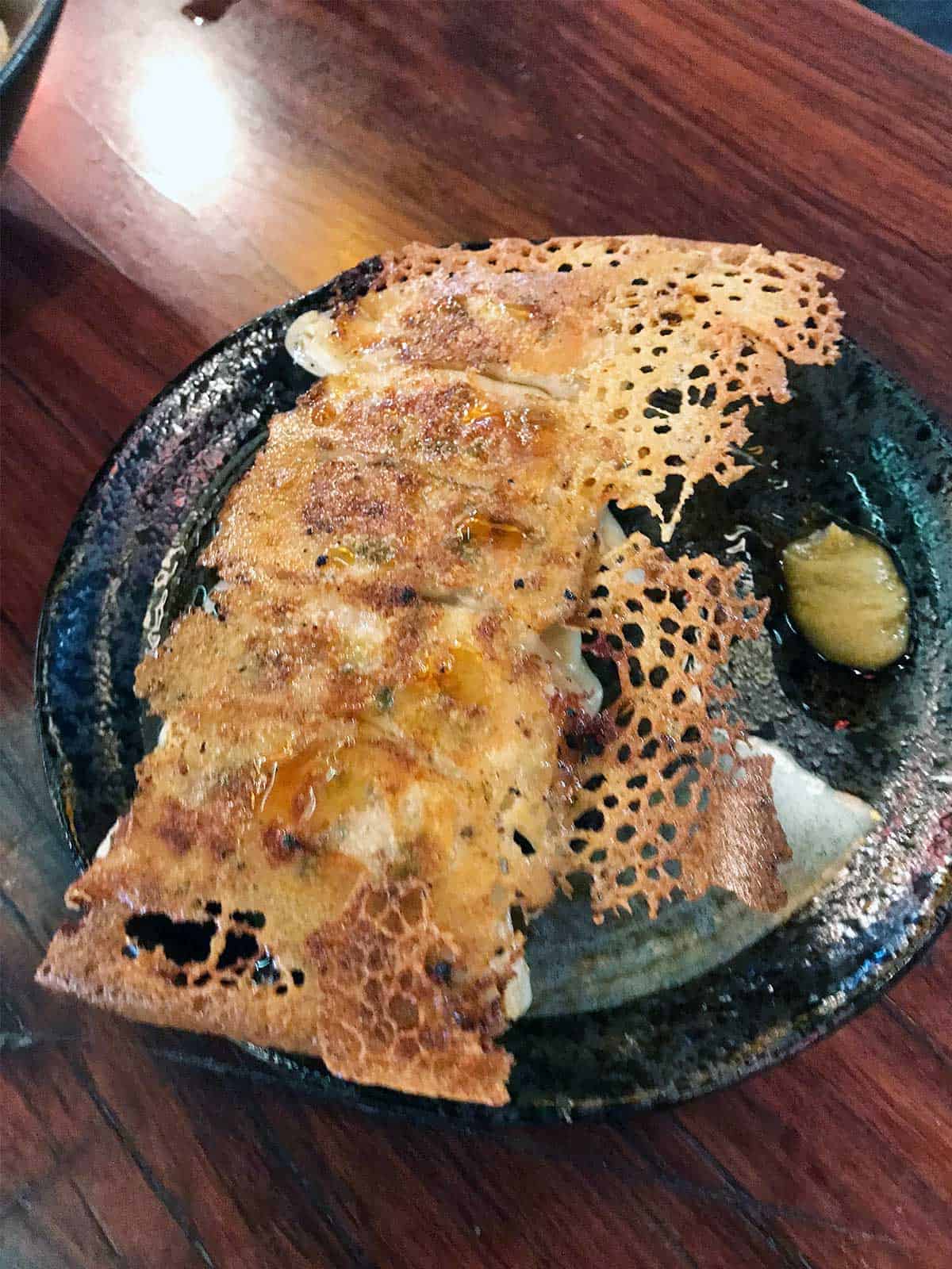 Fried gyoza on a plate.