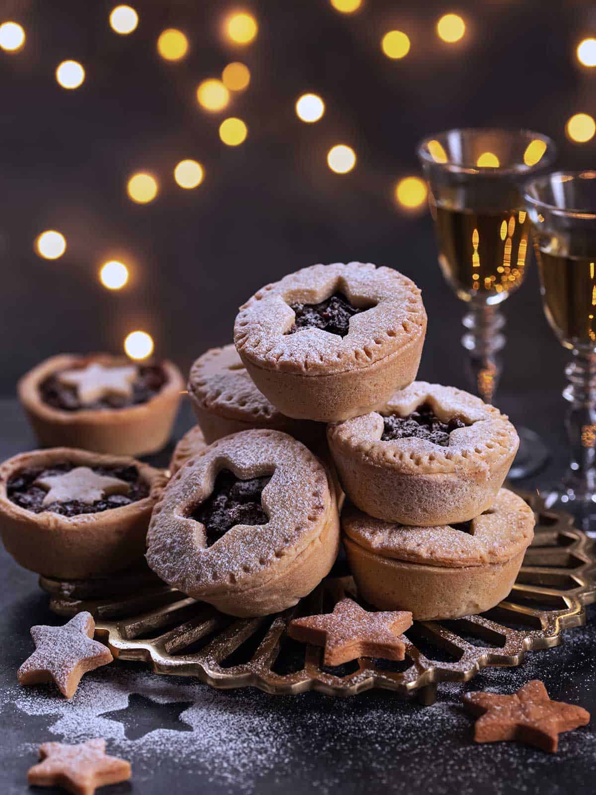 A stack of fruit mince pies on a plate.